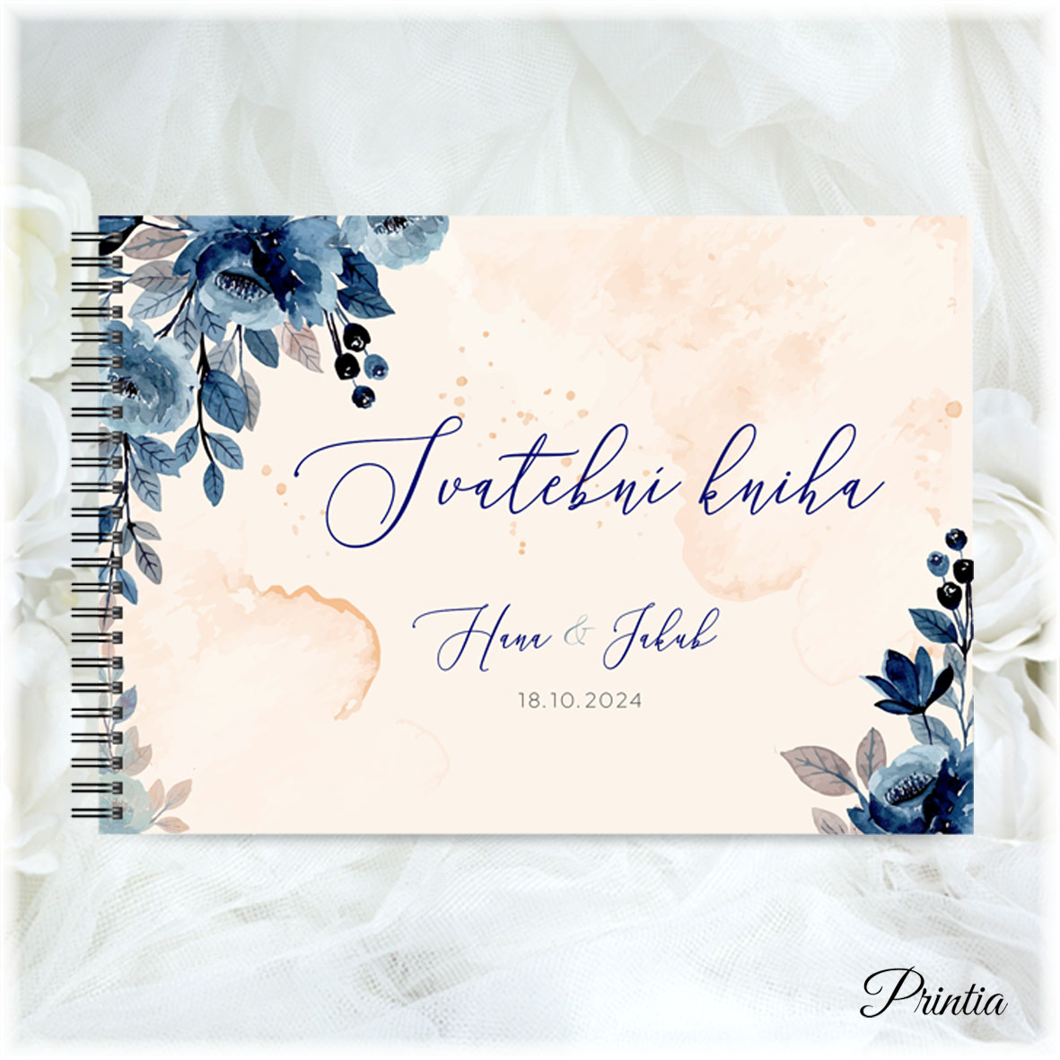 Wedding book with blue leaves on a cream background