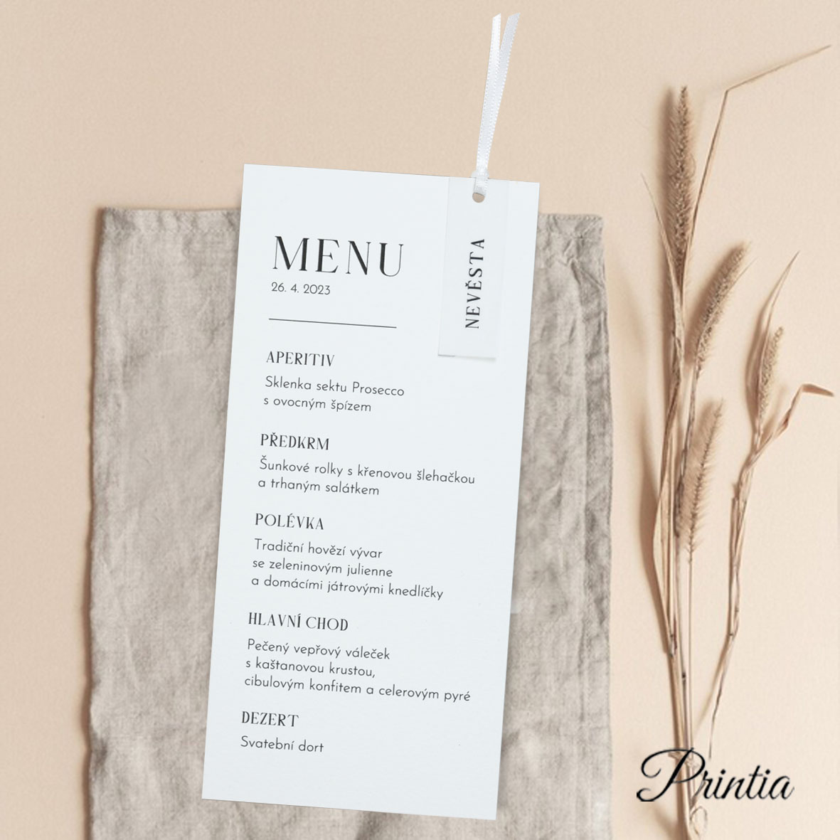 Wedding menu with name card tied up by a ribbon