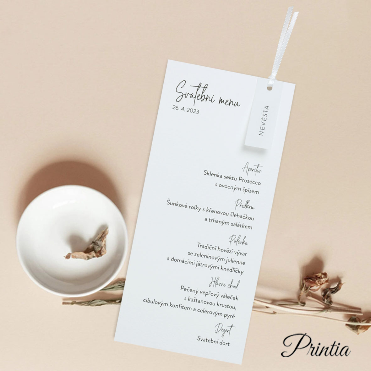 Wedding menu with white ribbon and name card