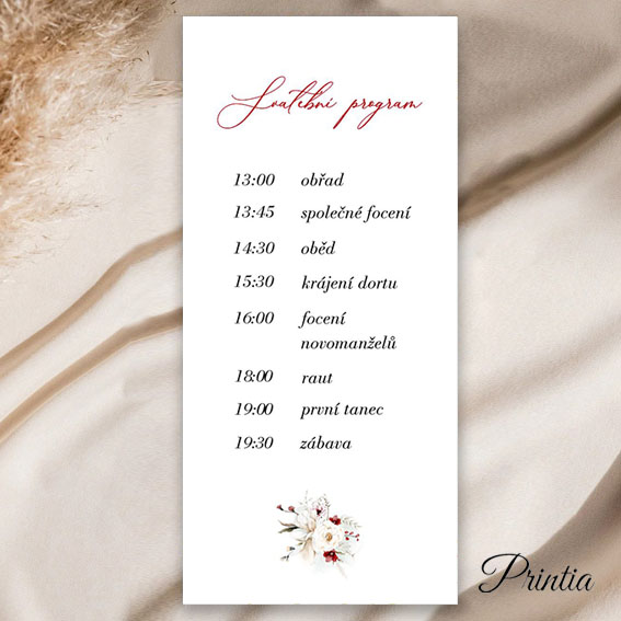 Wedding program with red and white flowers