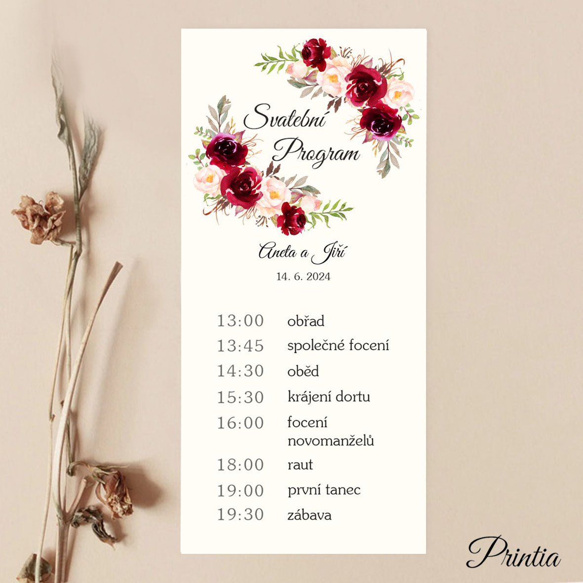 Wedding program with red flowers