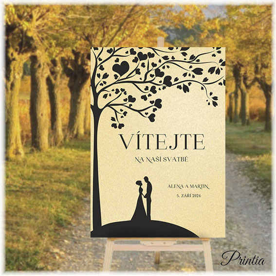 Wedding welcome sign with a couple under a tree