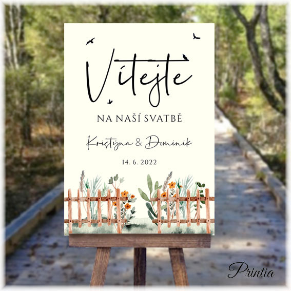 Wedding welcome sign with flowers behind the fence 