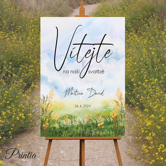 Wedding welcome sign with a meadow of yellow flowers