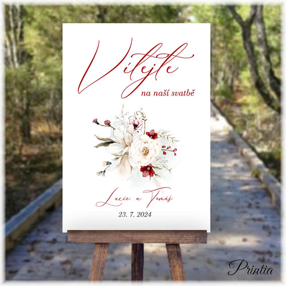 Wedding welcome sign with red and white flowers