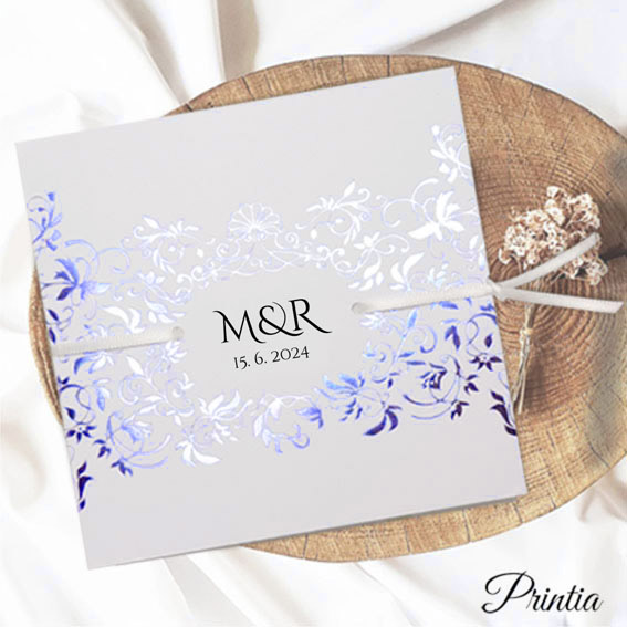 Opening elegant wedding invitation with