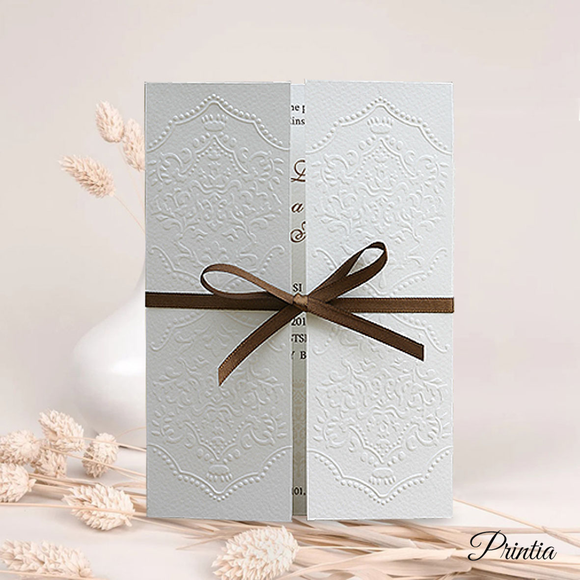 Wedding Invitations with brown ribbon and ornaments