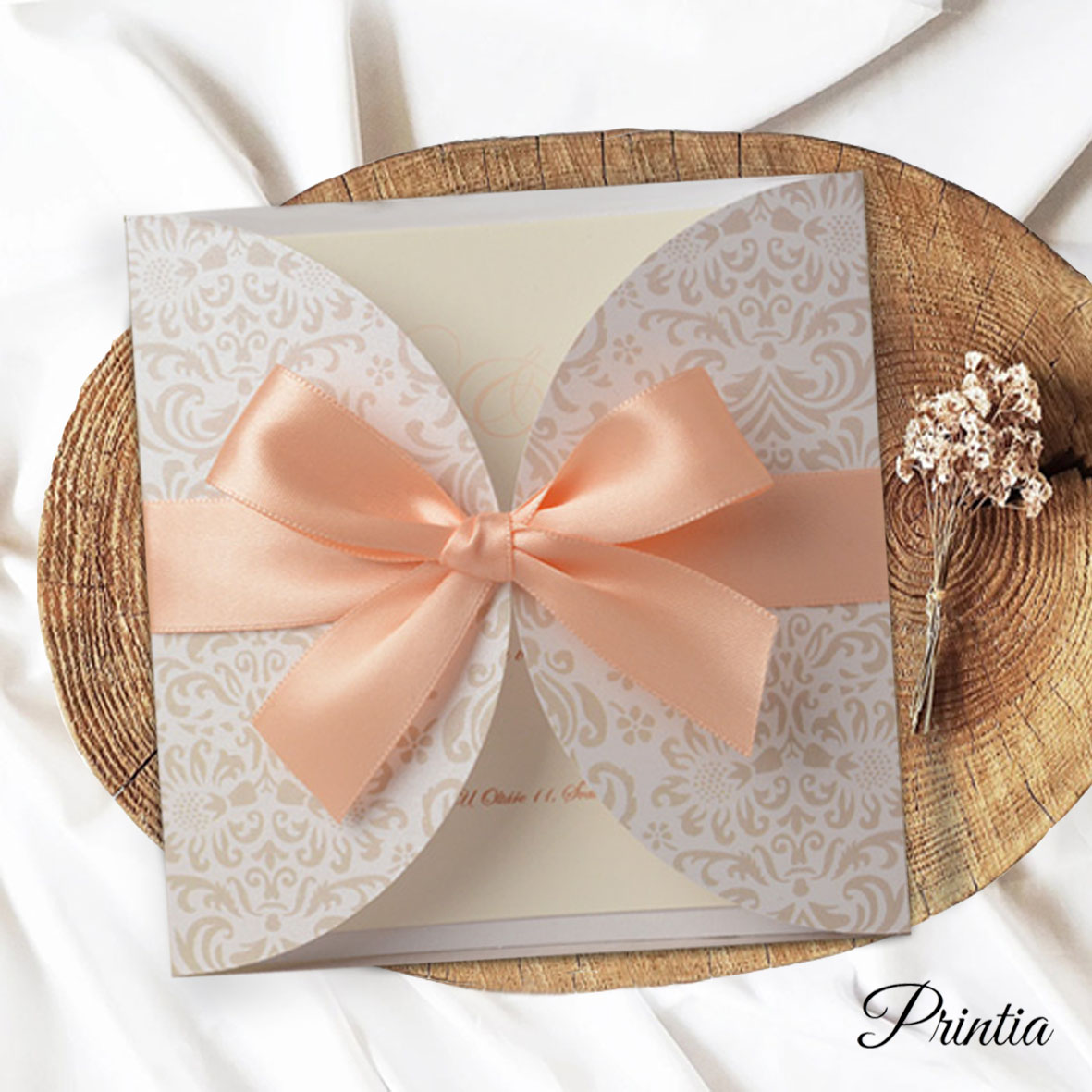 Exclusive wedding invitation with apricot ribbon