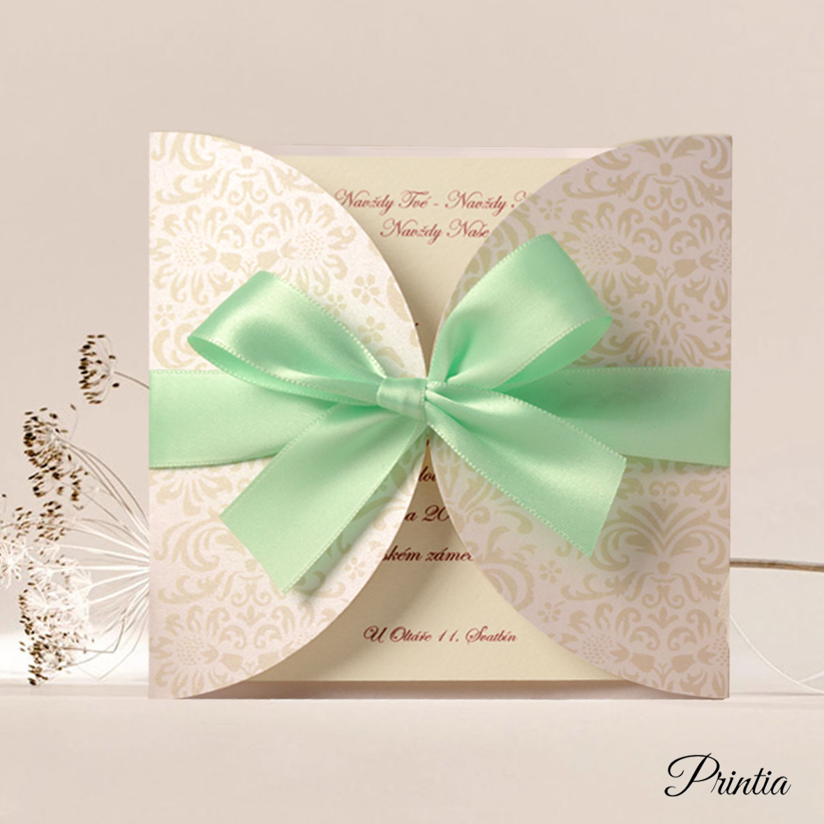 Exclusive wedding invitation with mint ribbon