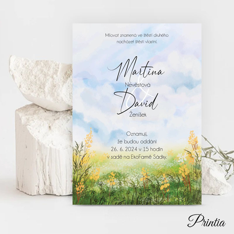 Wedding invitation with a meadow of yellow flowers