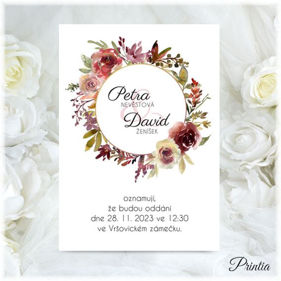 Wedding invitation with a wreath of autumn flowers