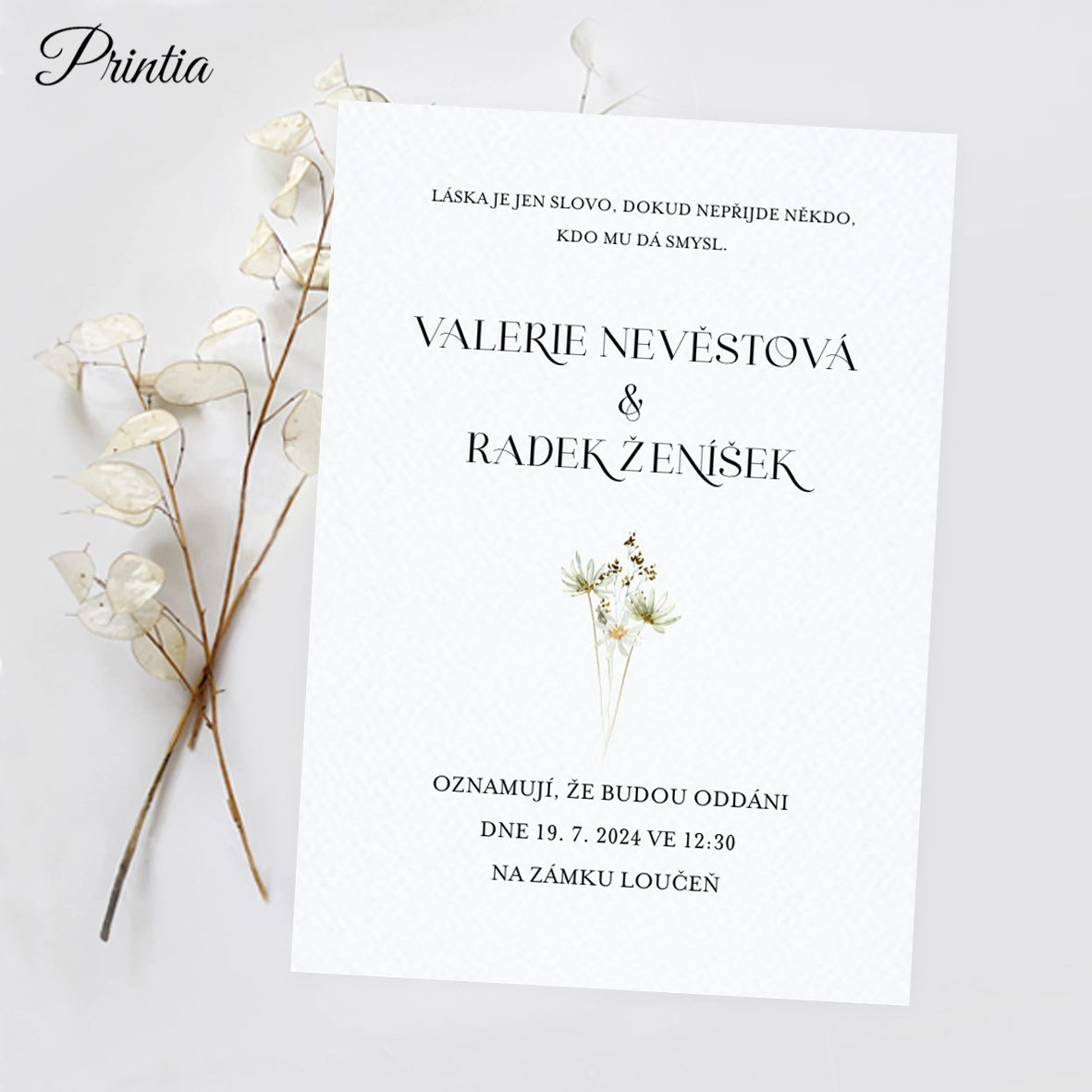 Wedding invitation with delicate watercolor flowers
