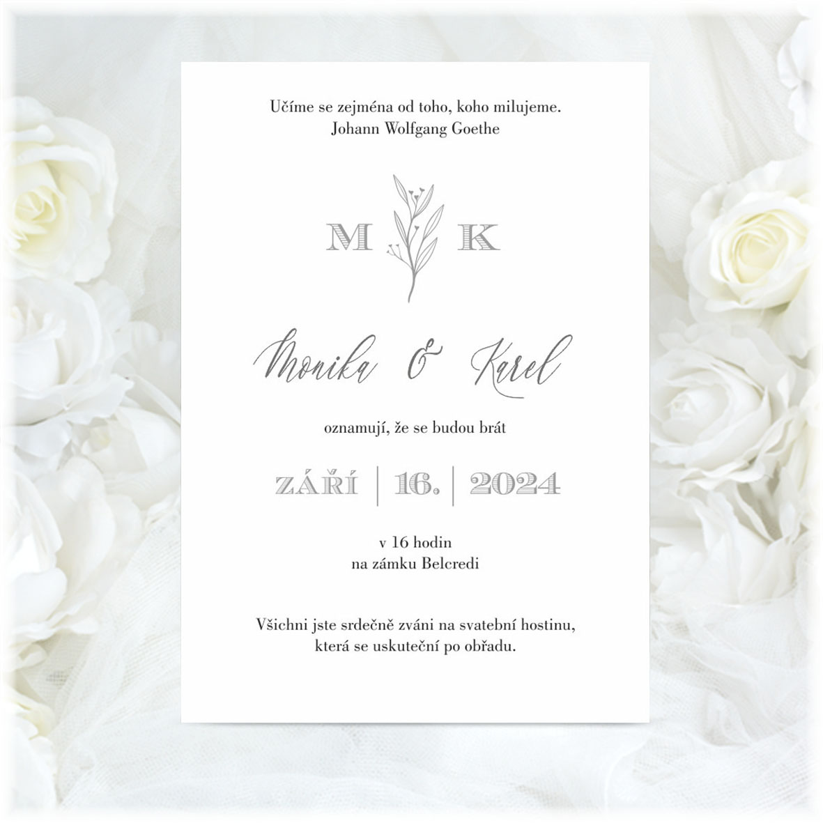 Simple wedding invitation with twig and initials of engaged couple
