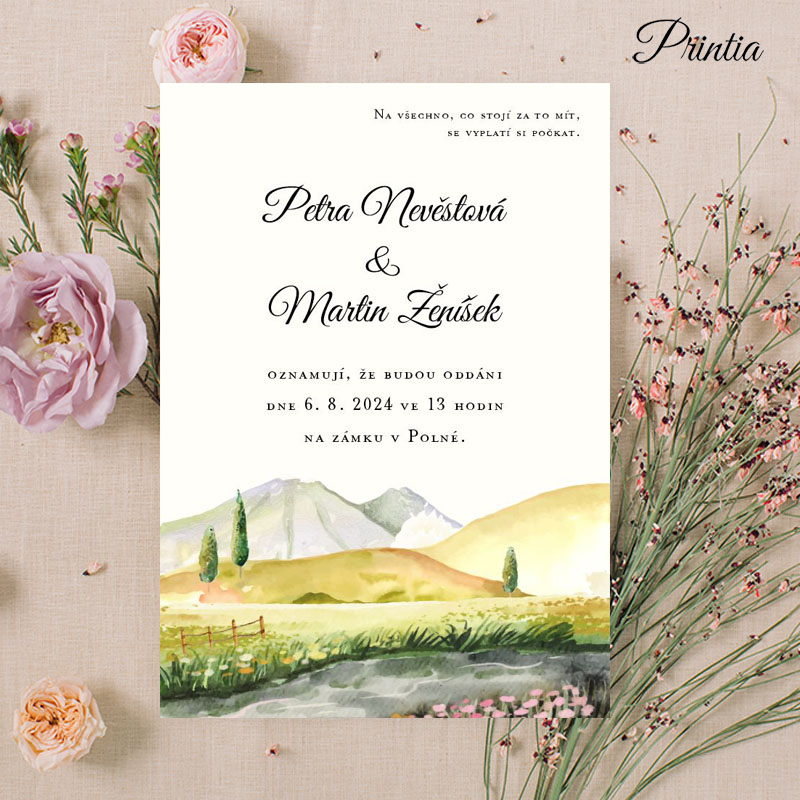 Wedding invitation with a meadow and mountains