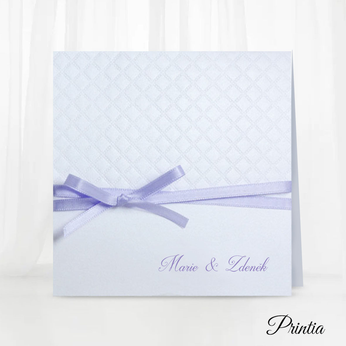 Pearl wedding invitation with a violet bow