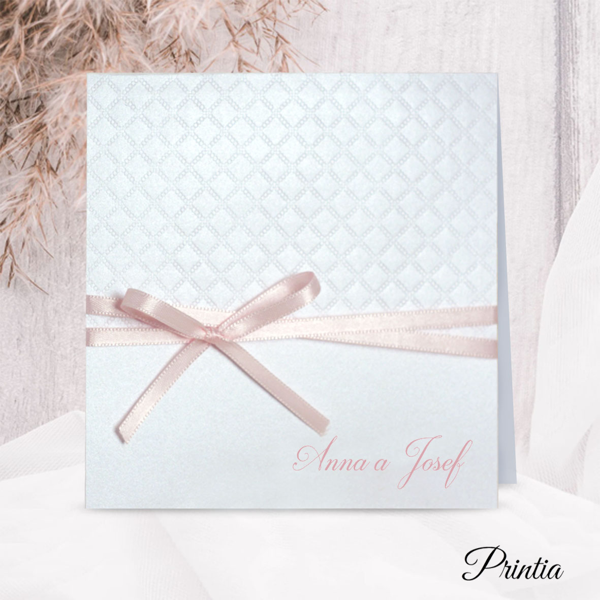 Pearl wedding invitation with a pink bow