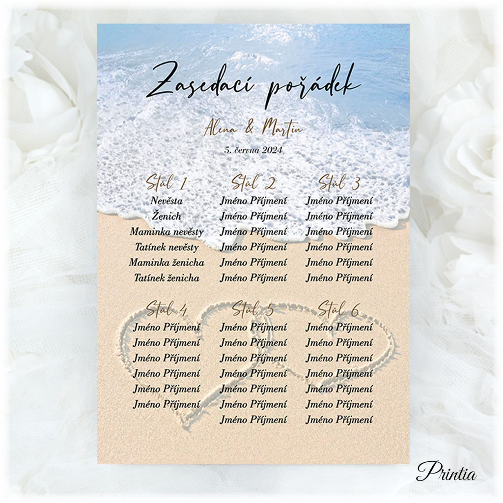 Wedding seating chart with hearts on the beach